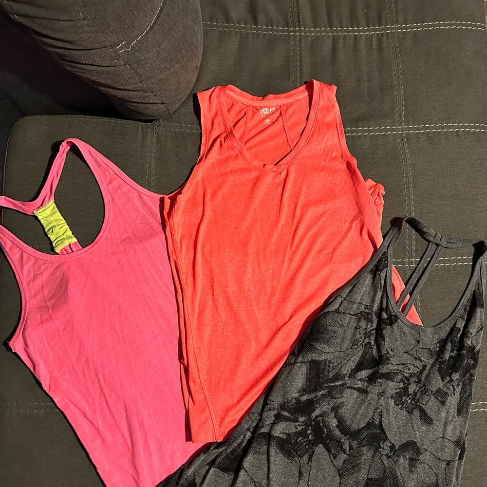 Three athletic tanks